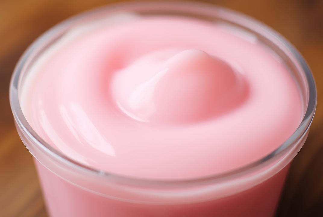 . Soft Slime: A close-up of slime in a container, photographed with a slow shutter speed to create a soft focus effect.;